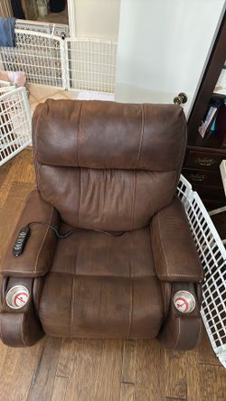 Pride Viva Lift Electric Recliner chair with foot rest and cup holders.   Made by Viva Lift Pride. Sold by Spin Life.
