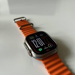 Apple Watch Ultra titanium with orange ocean band