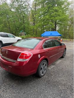 Saturn Aura XE, Sedan, Four Door, Sunroof, Red exterior, tan interior,