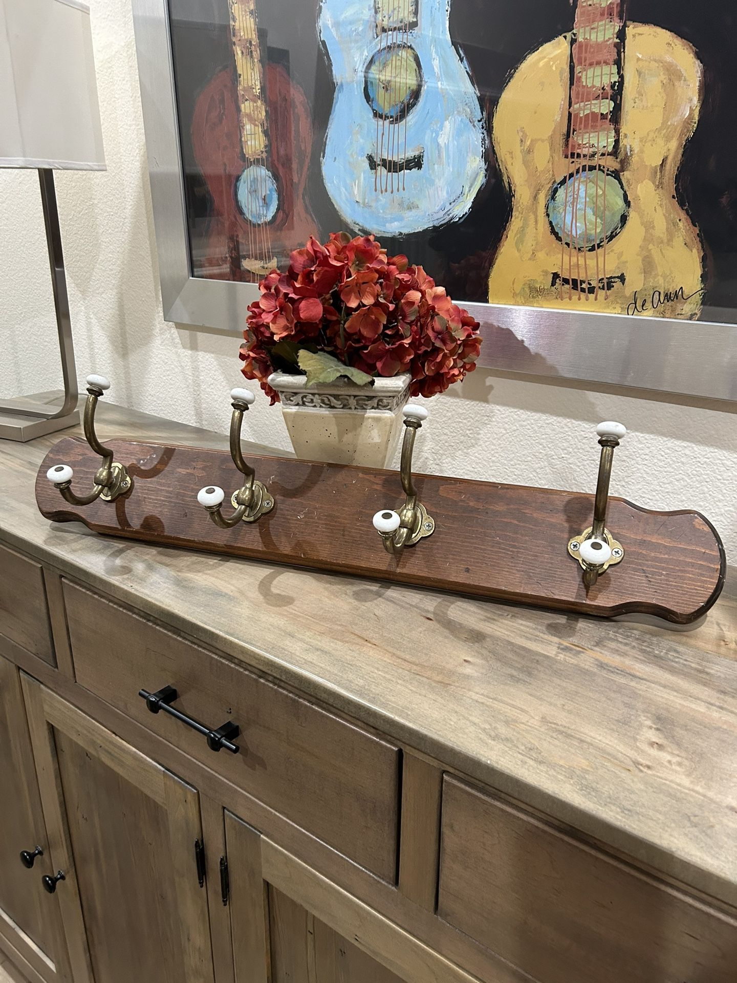 Wooden coat rack with four, strong, solid brass hooks and ceramic accents