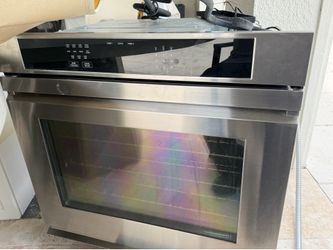 For sale gas stove with hood,refrigerator luxury,ice maker,and a warmer