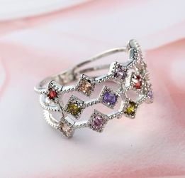Silver sterling ring with little colored topaz