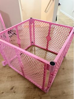 Pink playpen for puppies or babies