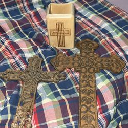 Two Metal Crosses And A Pen Holder