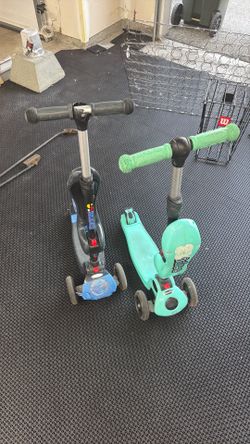 2 skidee scooters - one has cracked handle