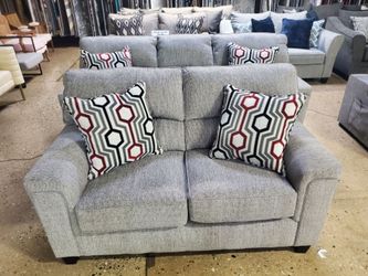 Gray Fabric sofa and loveseat with red and gray accent pillows (New)