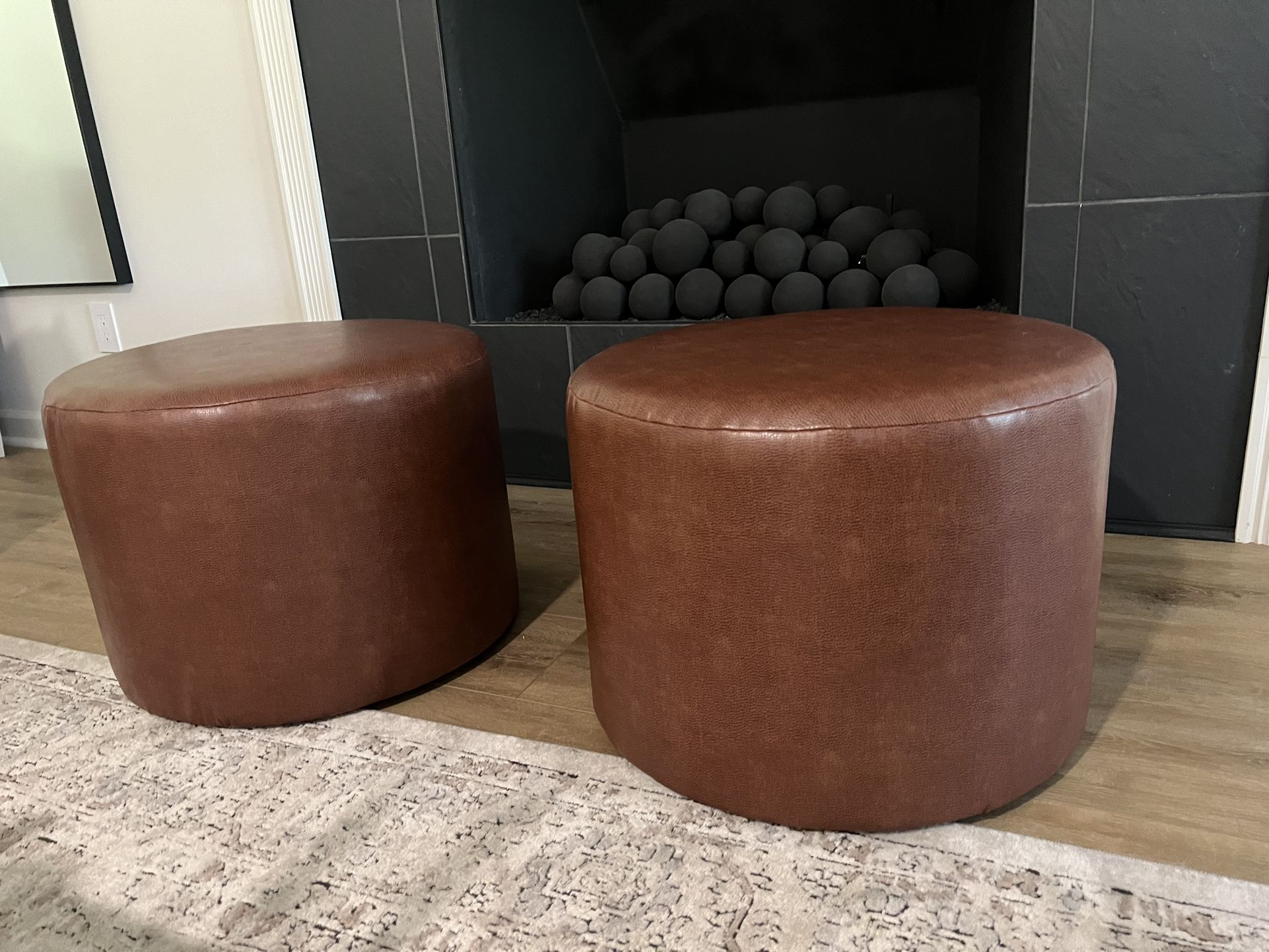 Two Brown Ottomans