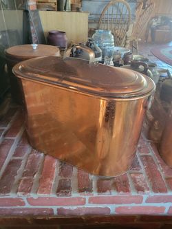 Antique solid copper boiler vessel with lid and side handles.