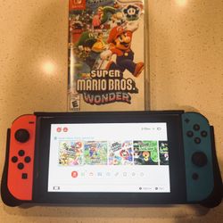 LIKE NEW NINTENDO SWITH  BRAND NEW CONTROLS! FREE GAME!