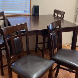 High top dining table with four chairs