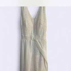 White, maxi, elegant dress with lace detailing and deep v-neckline