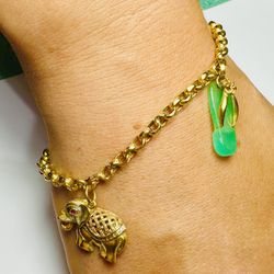 14k Gold Bracelet with charms 
