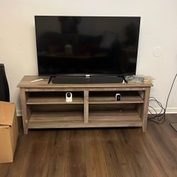 TCL Tv With Sound Bar And Cabinet