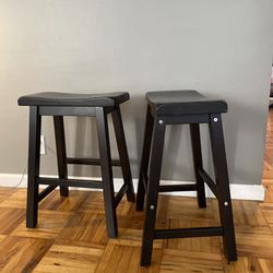 Two Black Wooden Stools