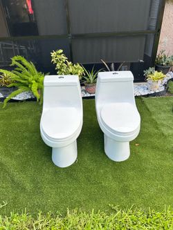 McClure 12 inch Rough In One-Piece 1.1 GPF/1.6 GPF Dual Flush Elongated Toilet in White Seat Included