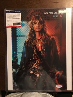 11 x 14 photo of Halle Berry into German Shepherd’s from John Wick three she’s a very beautiful lady there’s a black sharpie autograph she has a cert