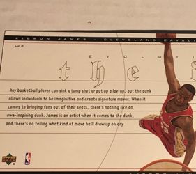 2003 Upper Deck LeBron James "Evolution of the Dunk" #LJ2 oversized box topper rookie card featuring LeBron James in his Cleveland Cavaliers uniform.