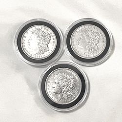 About uncirculated-AU(50) condition seal in capsules 1921 Morgan silver dollars