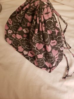 Lightweight drawstring sac, fabric, size about 12 inches long
