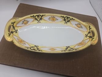 Antique Hand Painted Nippon porcelain relish dish with gold trim and floral design.