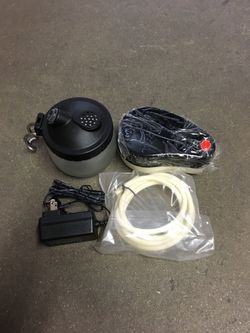 New in box $20 mini airbrush compressor with glass cleaning pot air hose