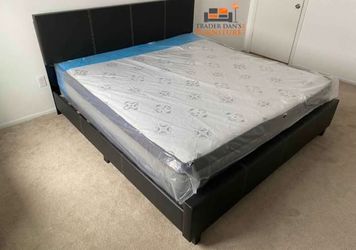 Brand new king size black faux leather platform bed frame with pillowtop mattress.
