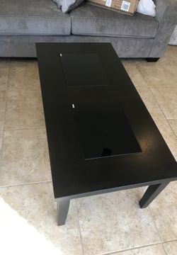 Brand new Ashley coffee table and 2 end tables