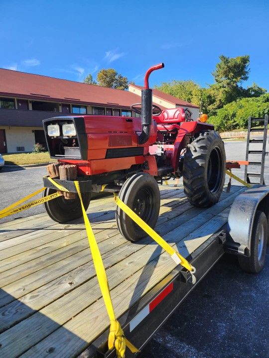 1979 International 244 Diesel Tractor And A 2023 Dual Axle Car Hauler