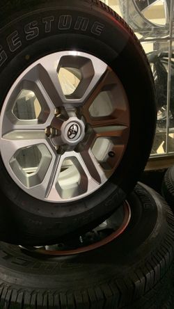 2657017 bridge stone rims and tire 70% on the tires for Toyota