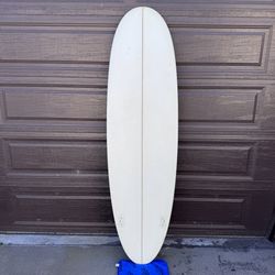 6'8" Mandala Doobie Disc surfboard with two sets of fins