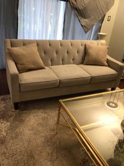 Light beige sofa with pillows