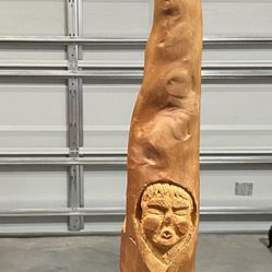 hand carved Cypress Knee depicting a couple. approximately 21” tall. very nice