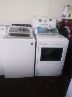 NEW scratch and dent GE top load washer and dryer set