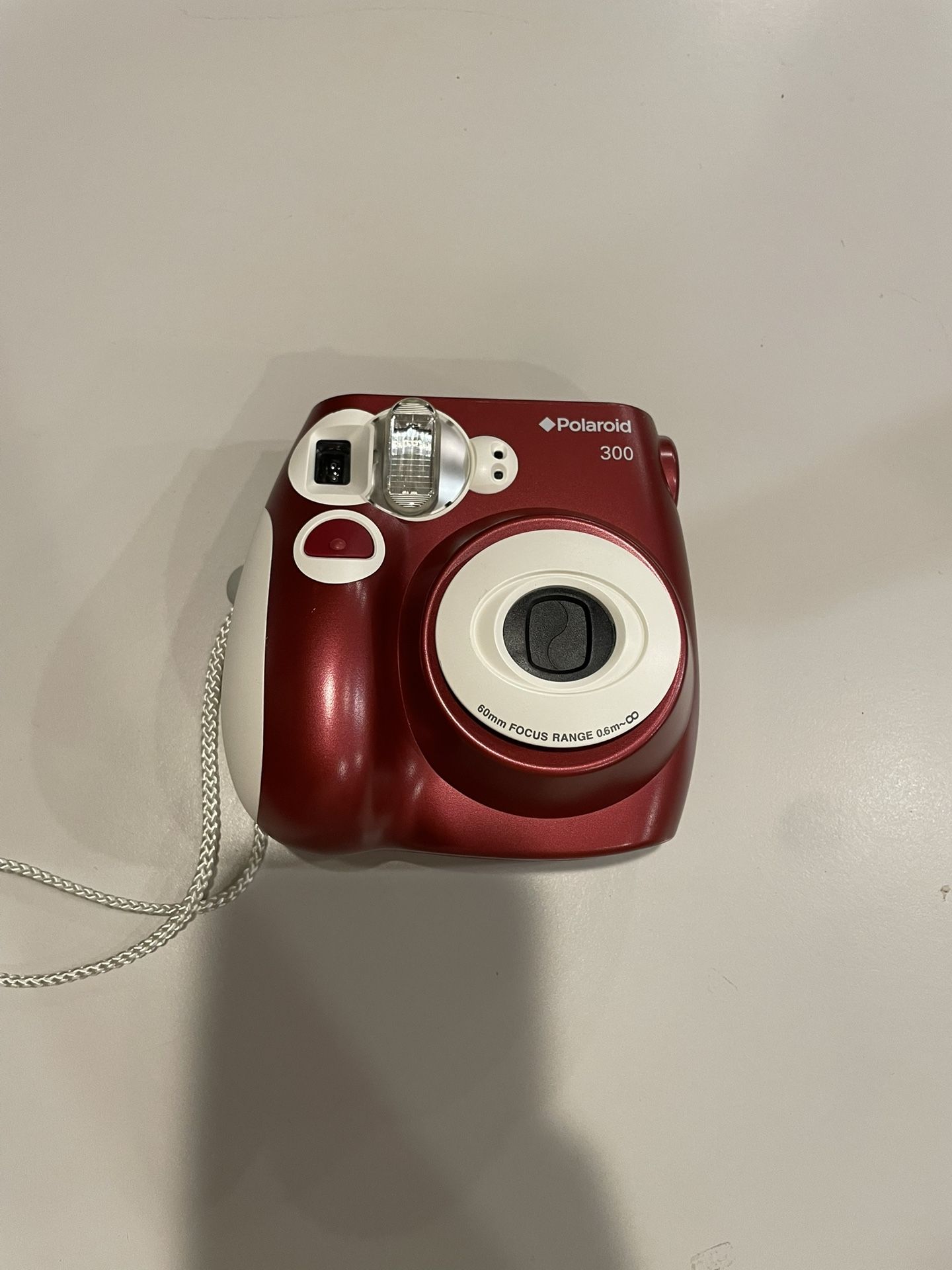 Maroon Polaroid 300 camera 60mm Focus Range