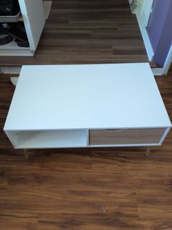 White coffee table with shelves for sale.