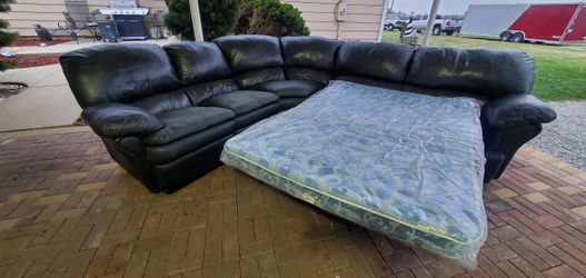 dark gray reclining sectional sofa sleeper. good for garage/shop.