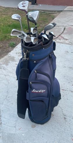 Blue Tour Edge cart golf bag with a mix of golf clubs
