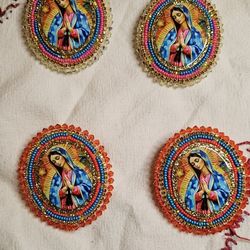 Artisanal earrings of the Virgin of Guadalupe. 