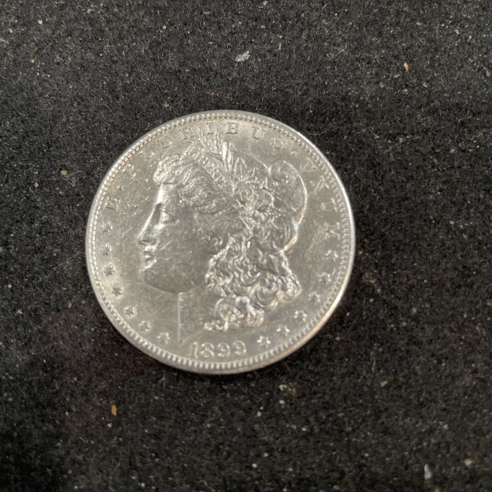 1899 Silver A/U Morgan Dollar In A Lightly Circulated Condition 272