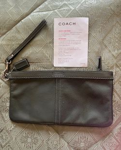 Coach leather wristlet with care instructions included $50 cash only. Cross posted