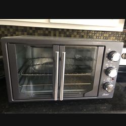  Prise Firm BrandNew  Oster ster Air Fryer Oven, 10-in-1 Toaster Oven, XL Fits 2 16" Pizzas, Stainless Steel French Doors  $169 Retail Price My Price 