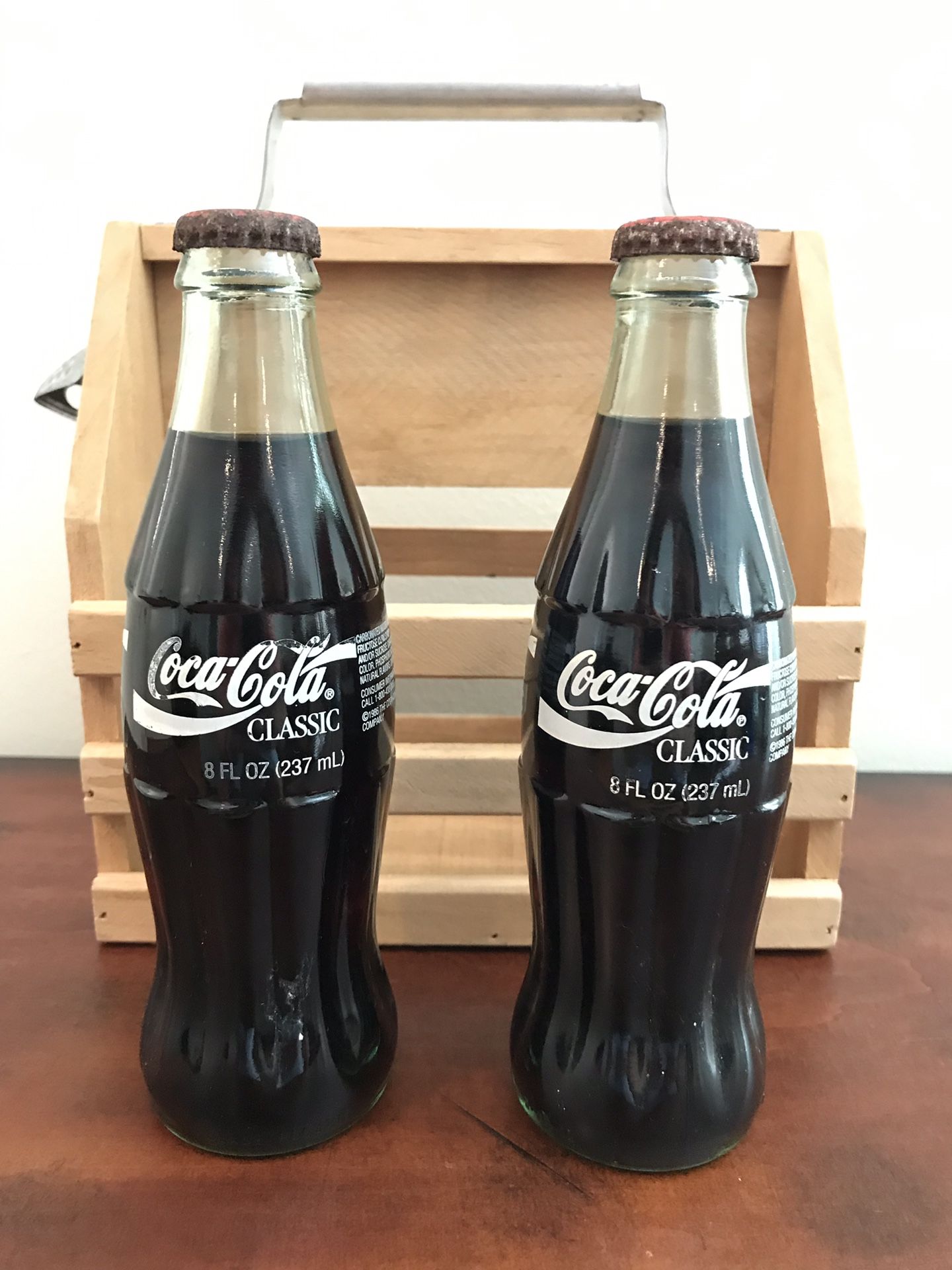 Set of Two Vintage 1986 Coca Cola Unopened Bottles with Wooden Carry Six Pack Holder