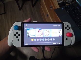 Nintendo switch oled with matching grip