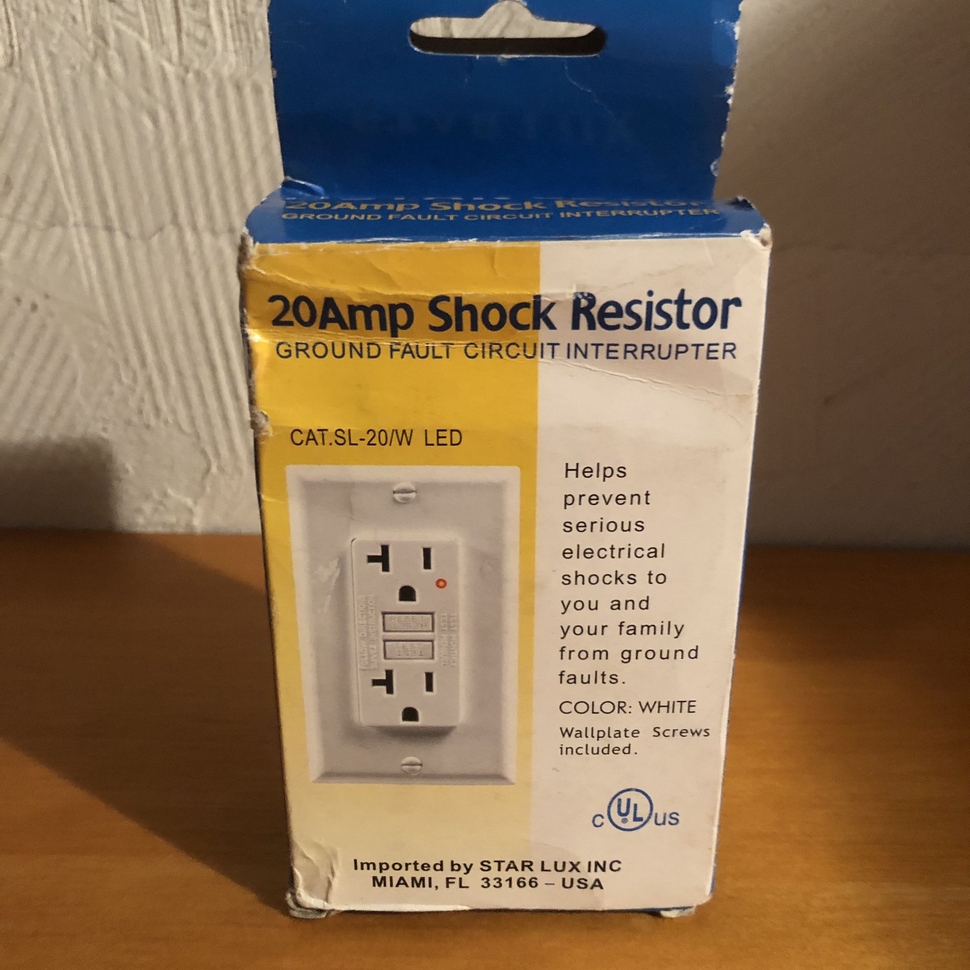 New in box 20 amp shock resistor ground fault circuit interrupter that helps prevent electrical shocks. The box is a little beat up but the equipment