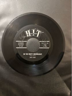 7 inch vinyl records in the Misty moonlight Marty Wood, one side GTO by the Roamers the other side
