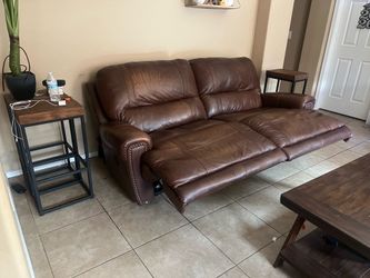Brown leather couches with 5 recliners
