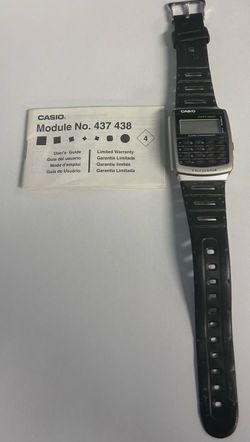 Vintage Casio A56 calculator watch with booklet