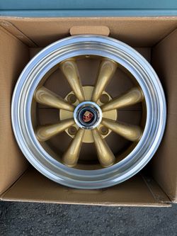 New 15" X 5-1/2" Vw Bug 4 Lug Gold -Silver Empi 8 Spoke Wheel with Polished Lip For Classic Vw Bug, Karmann Ghia, Porsche.  Only two Center Caps