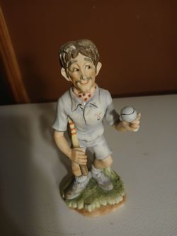 vintage ceramic pickleball player figurine, likely made in Japan. 
