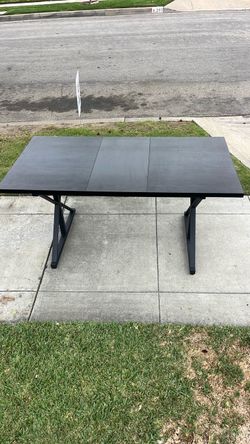 Kitchen or dining table. Apartment sized